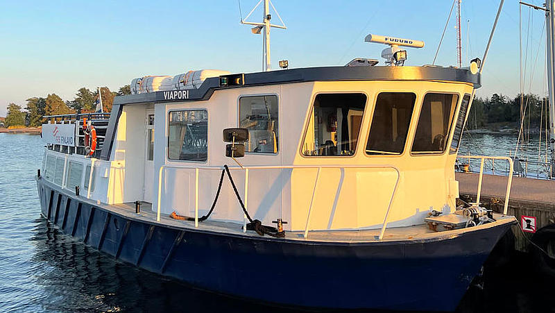 The passenger ferry "Viapori" illuminated by the evening sun.
